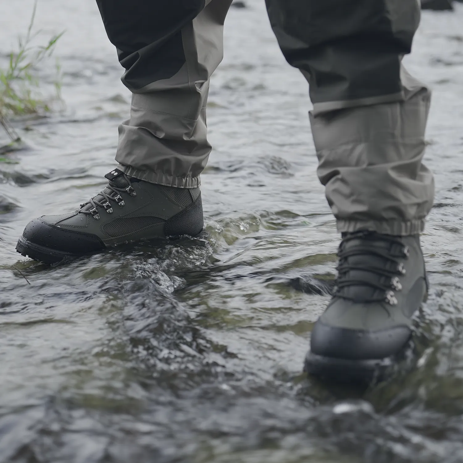 A man was standing on the water with anti-slip rubber sole wading boots