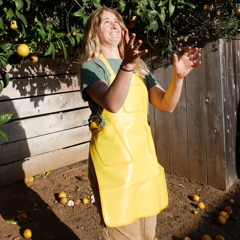 A woman was wearing Funwater multipurpose aprons and gardening