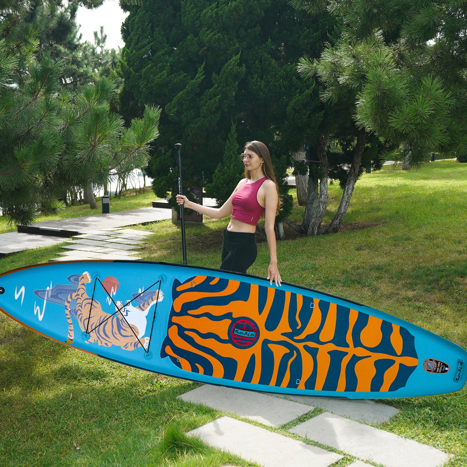 A woman was standing with Feath-r-lite adventure 11'6" paddle board