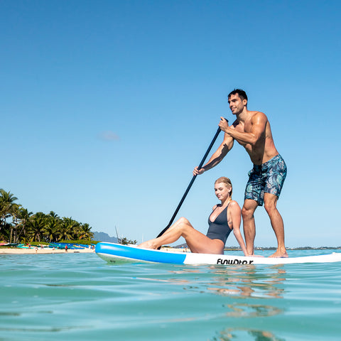 Funwater inflatable stand up paddle board is holding and taken by 2 people