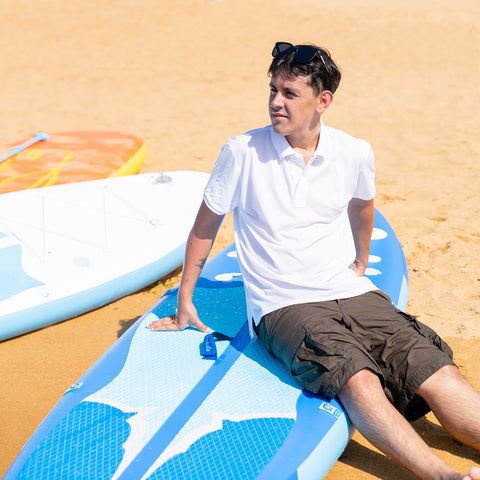 A man was sitting on FEATH-R-LITE MANTA RAY paddle board