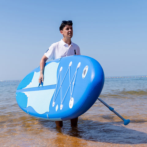 A man was carrying FEATH-R-LITE manta ray ultra-light paddle board inflatable