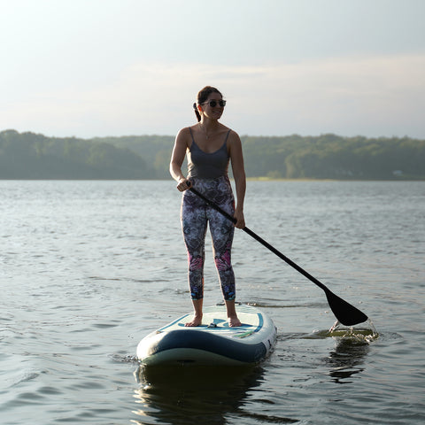 A women is paddleboarding with FUNWATER SEA TURTLE SUP