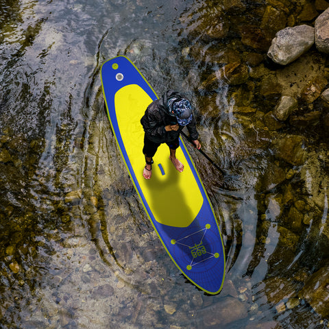 A man is paddling on Violet 11'6